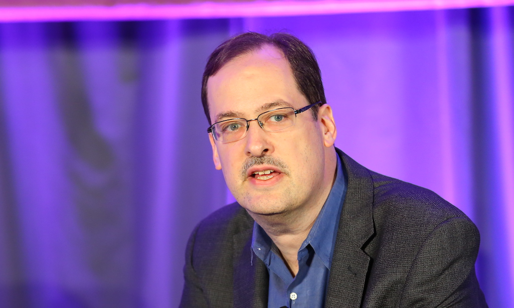 Playable Worlds Co-founder Eric Goldberg in front of a blurred purple background.